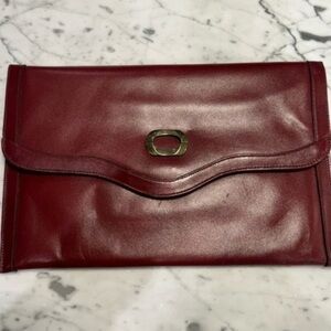 Vintage Etienne Aigner clutch. 1970s burgundy wine red leather I